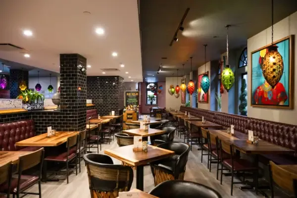 Rio Viejo dining room with colorful Mexican glass lamps